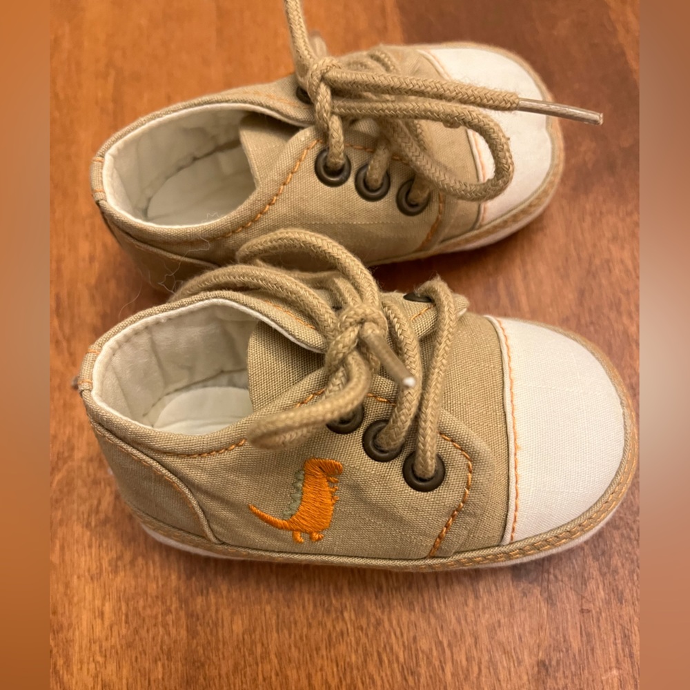 Newborn booties. Tan with cute little dragon.